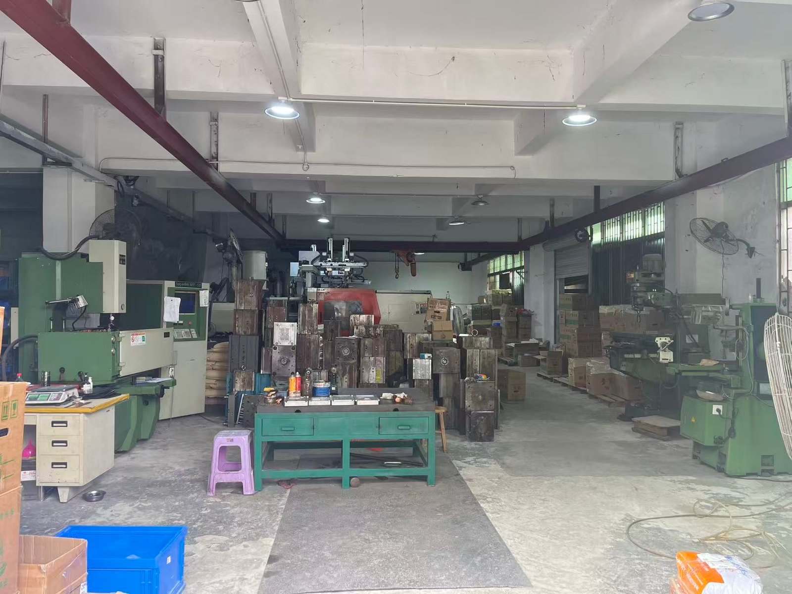 Machine and tooling shop where scale housings and load-cell mounts are prepared